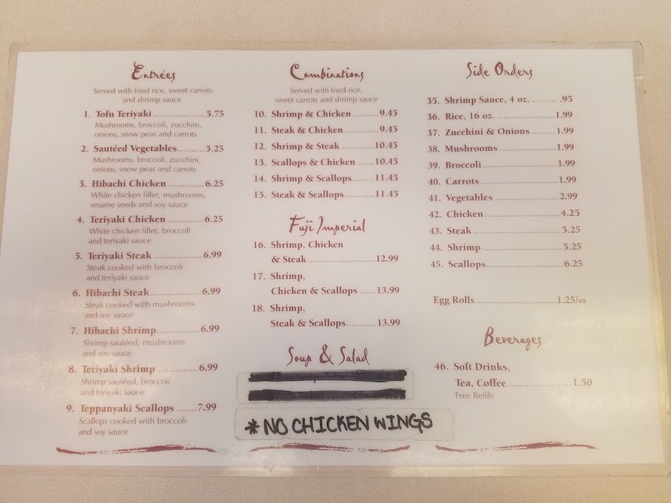 Restaurant menu with rice and soft drinks.